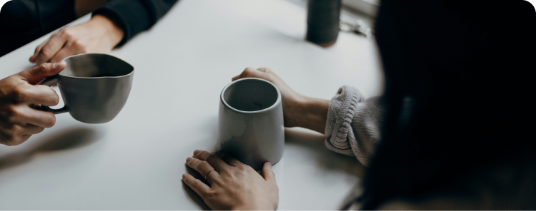 Hands holding coffee cups